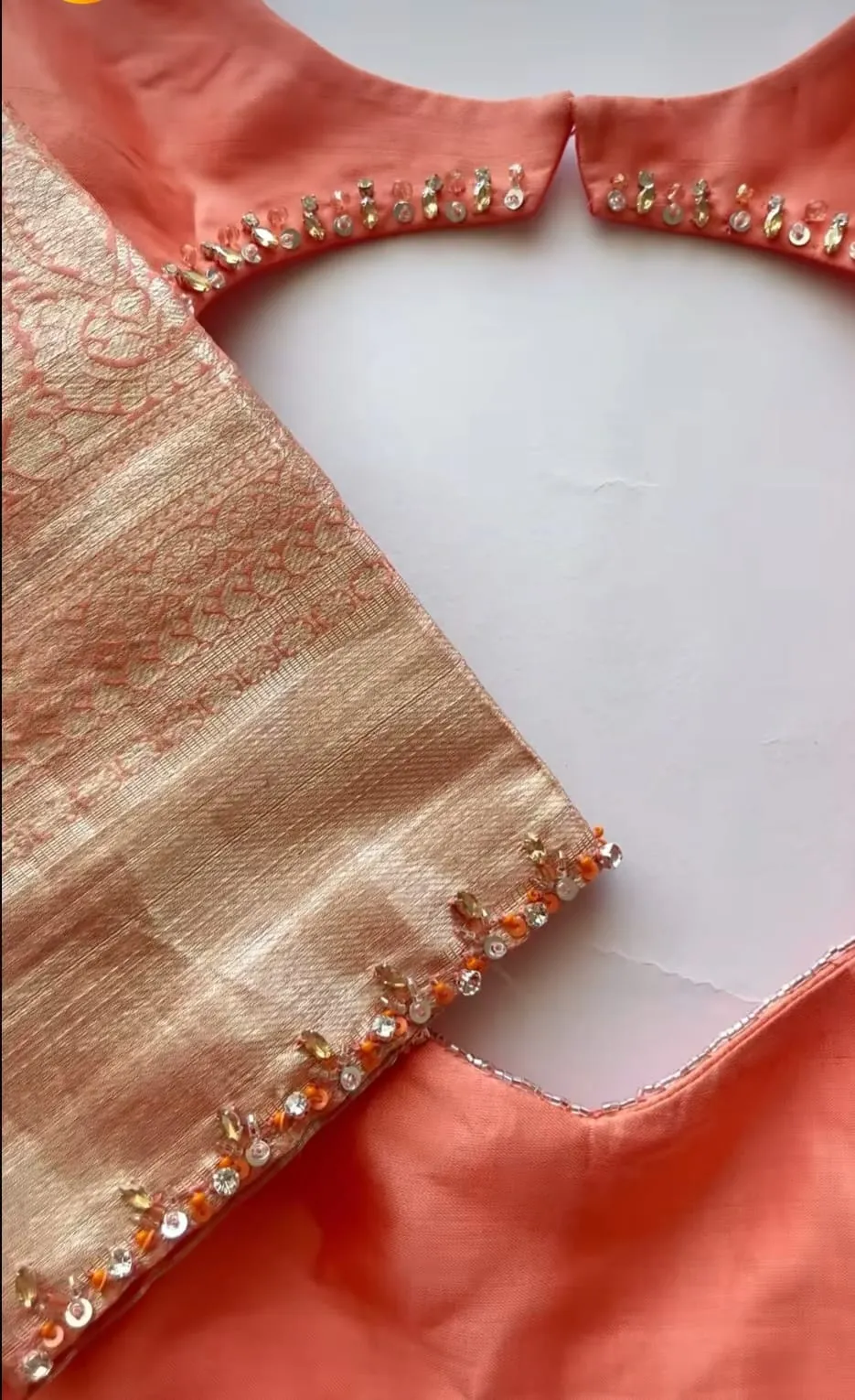 Elegant Glow – Orange Minimal Aari Work Blouse for Chic Occasions