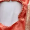Elegant Glow – Orange Minimal Aari Work Blouse for Chic Occasions