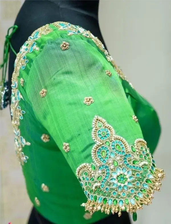 Pista Green Perfection: Designer Kundan Peacock Blouse for Royal Occasions