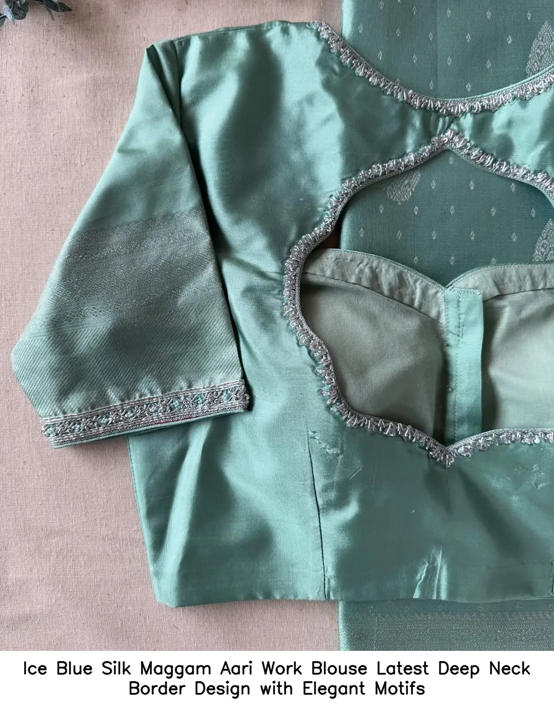 ​Ice Blue Silk Maggam Aari Work Blouse – Latest Deep Neck Border Design with Elegant Motifs