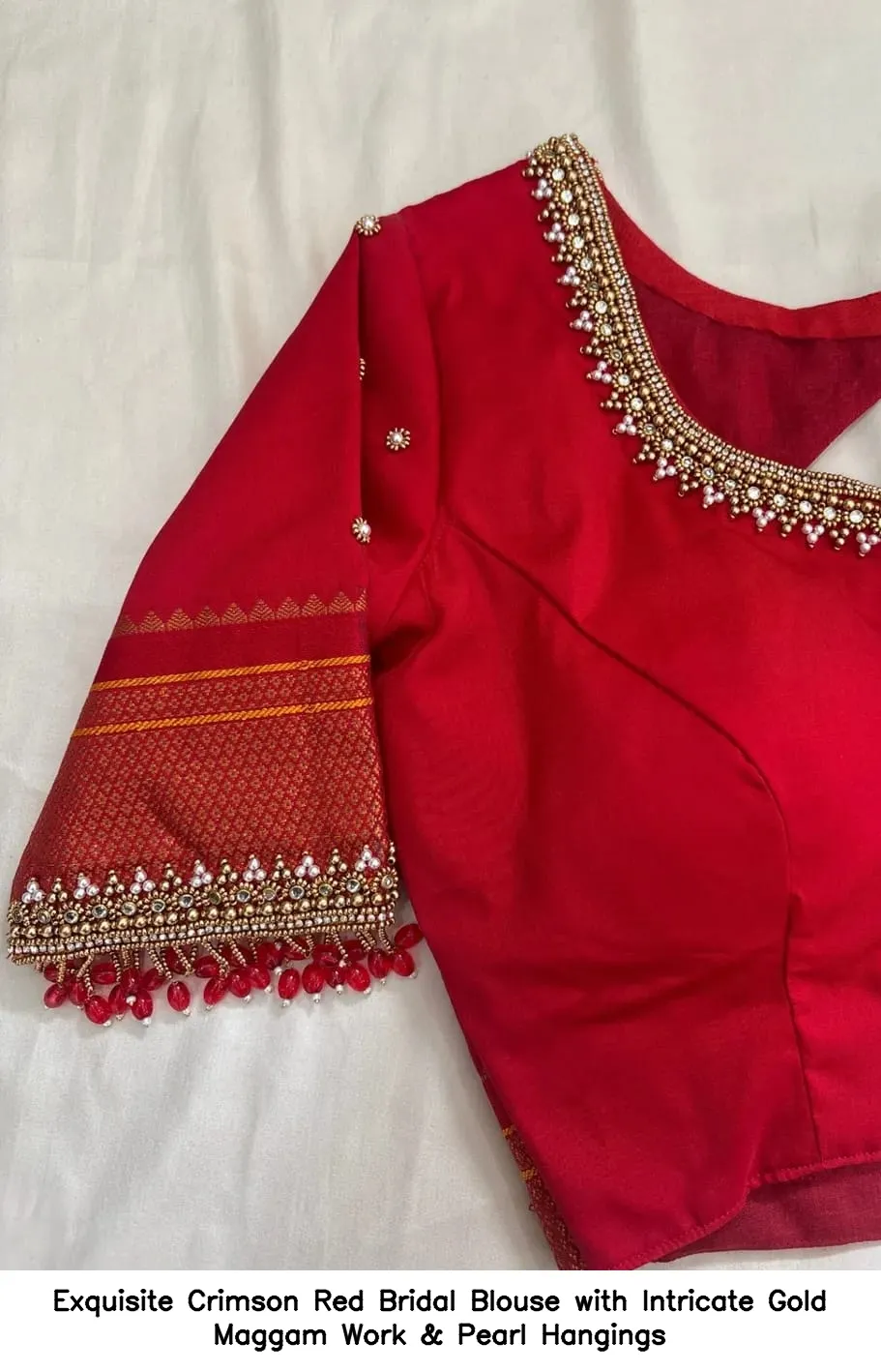 ​Exquisite Crimson Red Bridal Blouse with Intricate Gold Maggam Work & Pearl Hangings