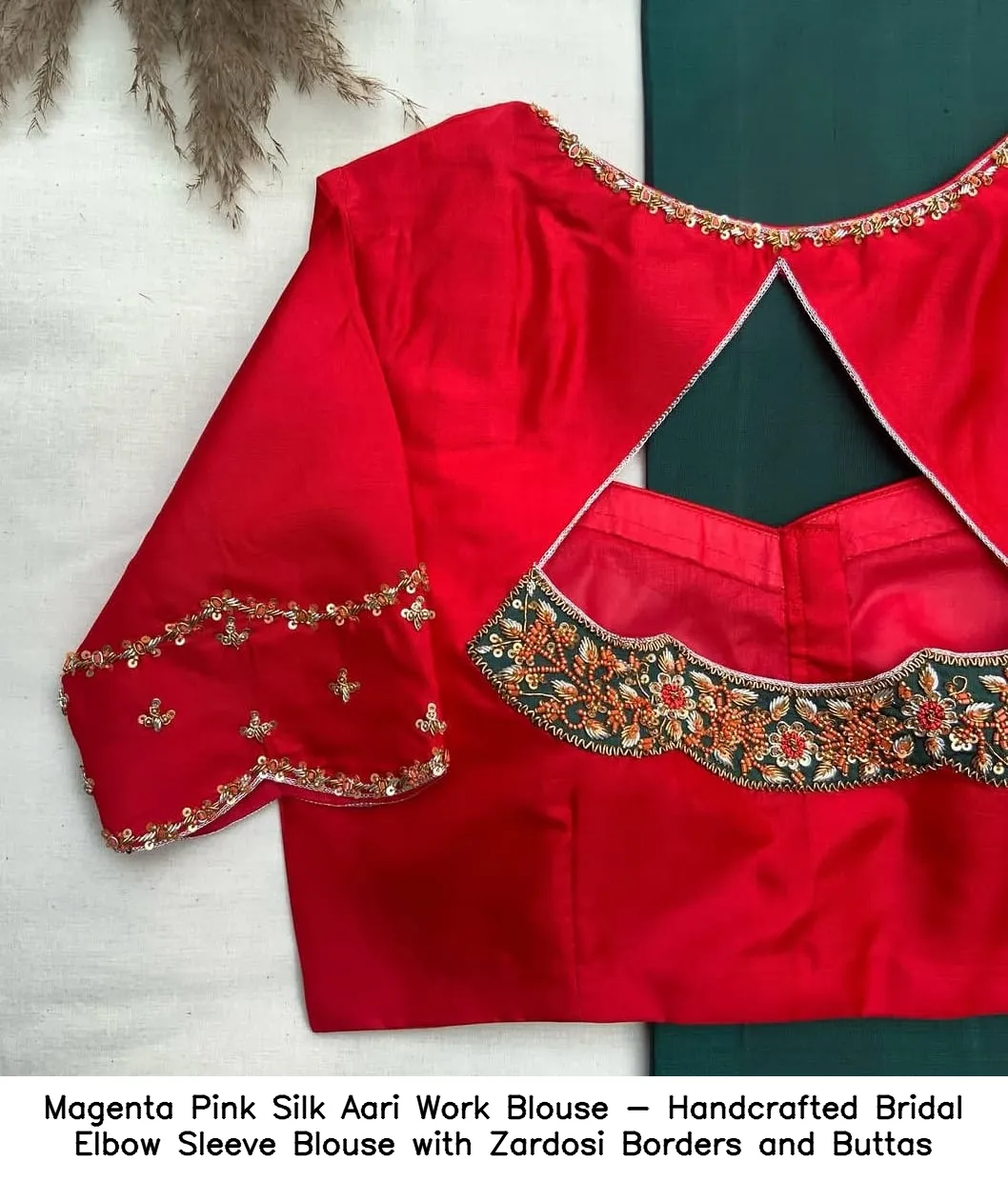 ​Magenta Pink Silk Aari Work Blouse - Handcrafted Bridal Elbow Sleeve Blouse with Zardosi Borders and Buttas