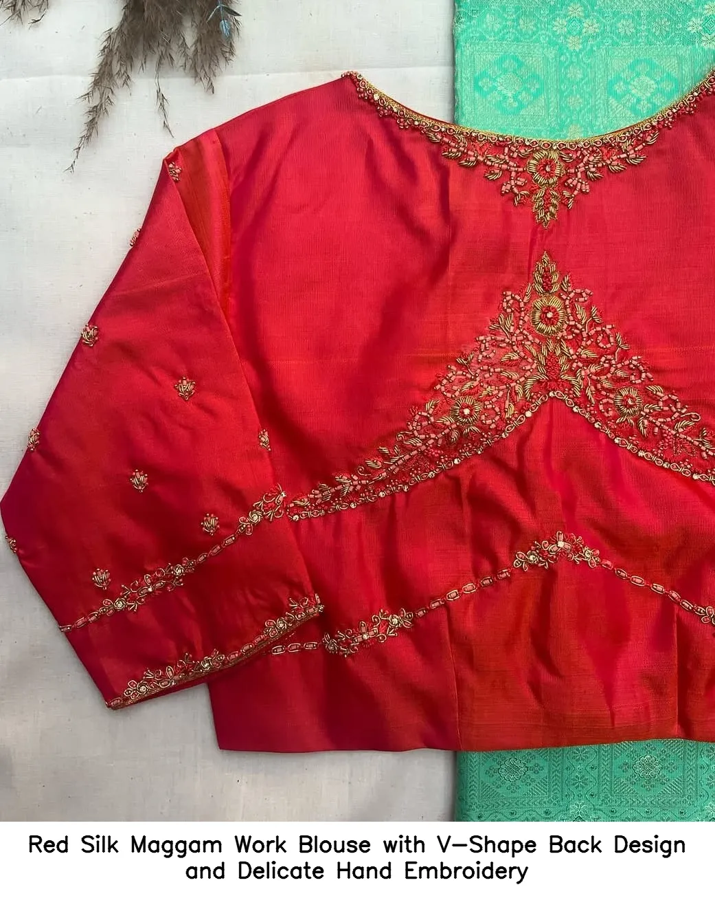 ​​​​​Red Silk Maggam Work Blouse with V-Shape Back Design and Delicate Hand Embroidery
